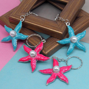 картинка Брелок 270-20 (12) Морская звезда с жемчужтной металл 5х0,5х5см  от магазина МОЛТИ