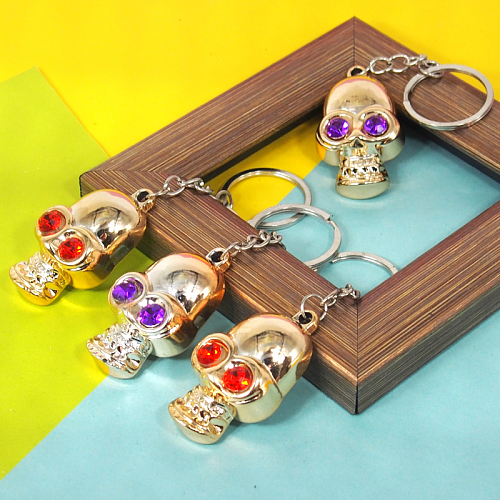 Брелок ЗД-06 (12) череп золотой 4,5х1х2,5см. пластик