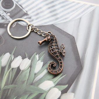 картинка Брелоки 2638-4 (12) Морской конек металл 4,5х0,5х2см от магазина МОЛТИ