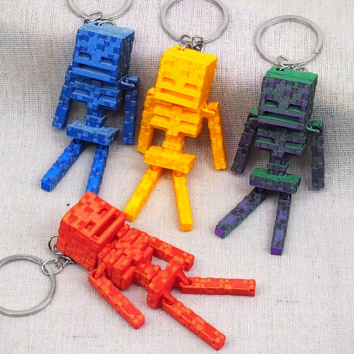 Брелок 8-22 (12) 3D костяной Игровой человек MY 9х2х2 см пластик 