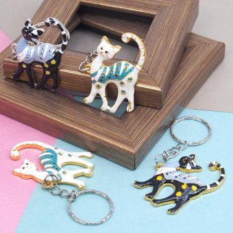 картинка Брелок 270-14 (12) Кошка эмаль металл 5х0,3х3см  от магазина МОЛТИ